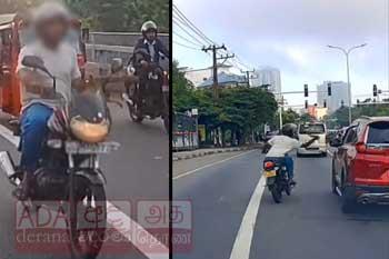 කැමරාවේ සටහන් වූ යතුරුපැදිකරුවෙකුගේ නොහොබිනා වැඩක්
